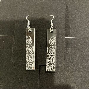 Acrylic rose earrings.
